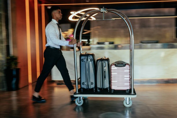 hotel-attendant-pushing-luggage